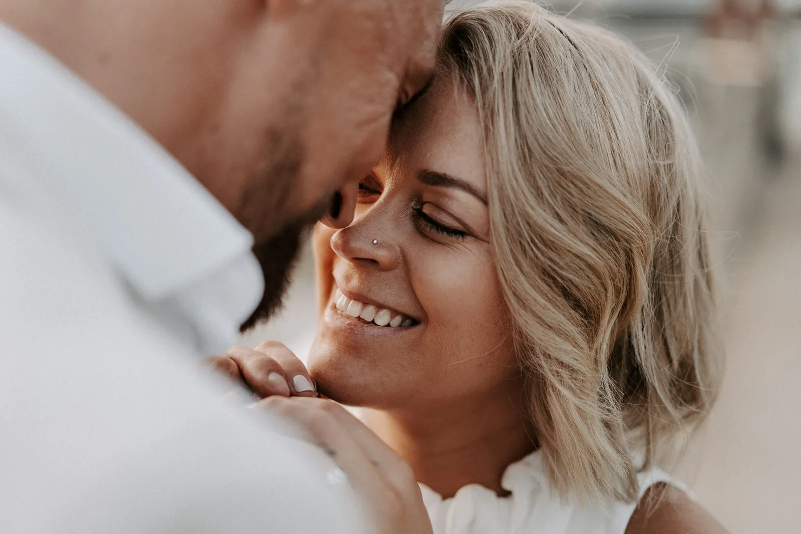 Shannon smiling as Jacksen leans his forehead against hers